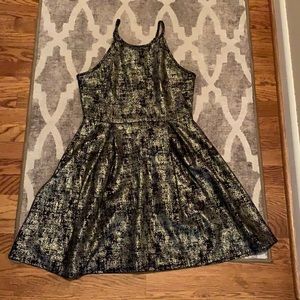 Soprano black and gold dress.